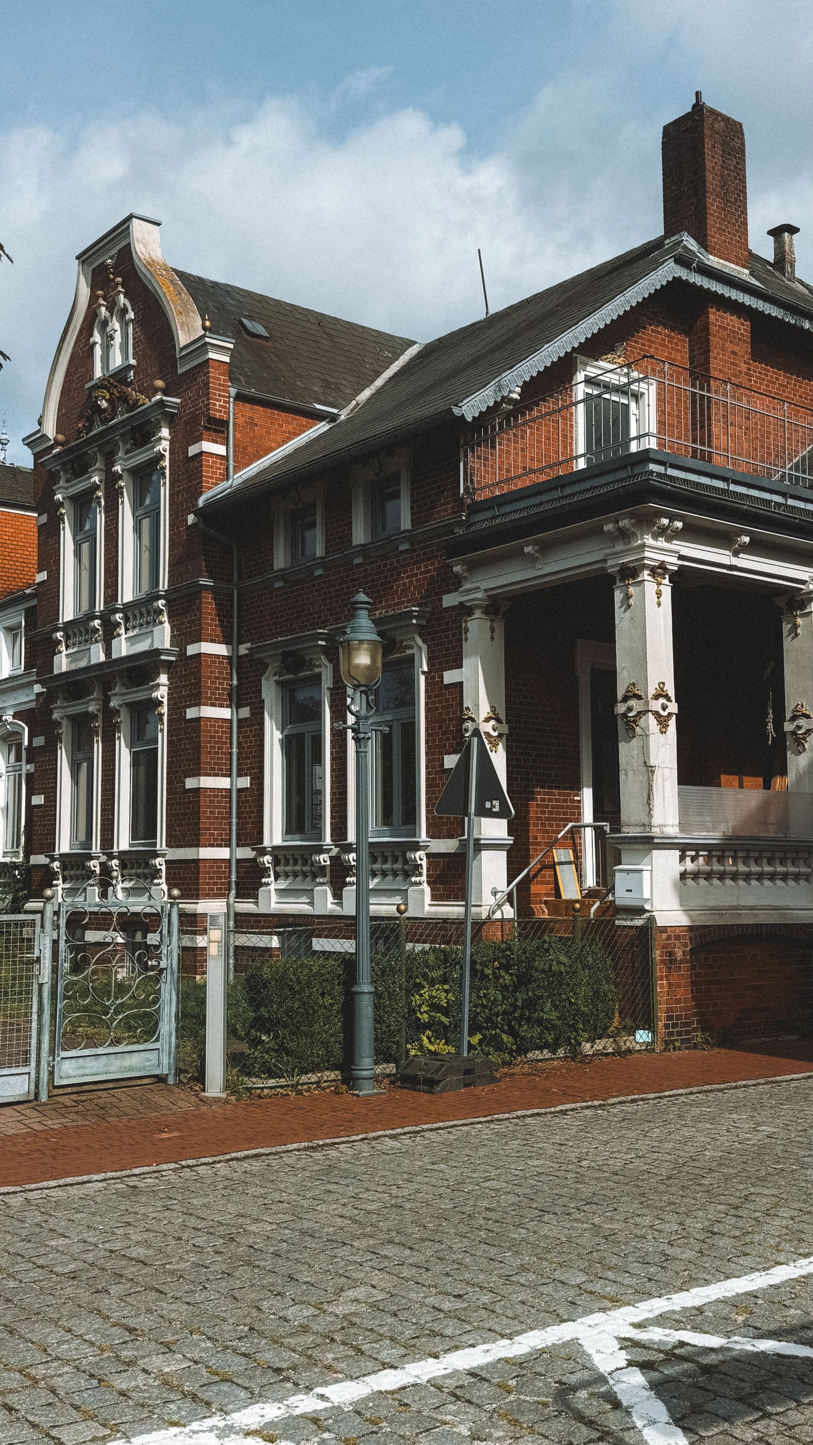 Historic red brick home with preserved architectural details